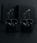 Black wireless earbuds with charging case on a dark background